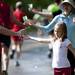 Cups of water is distributed to runners during the Dexter-Ann Arbor half marathon on Huron River Drive on Sunday, June 2. Daniel Brenner I AnnArbor.com